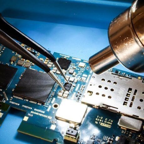 Technician repairing phone